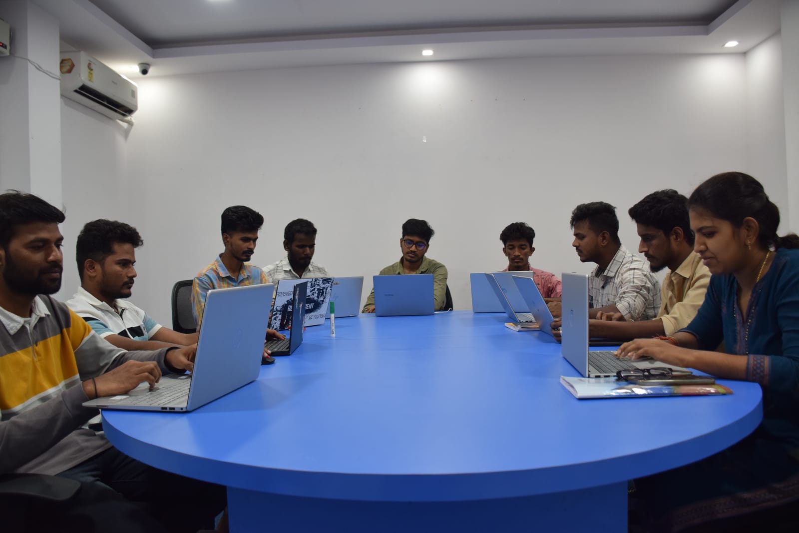 Students working on laptops in a Technohub classroom